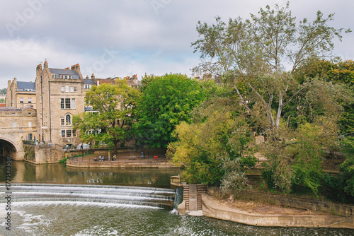 Pulteney Bridge in wonderful day, perfect for sightseeing, as viewed from the Parade Gardens, Bath, England.