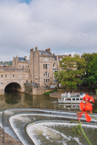 Pulteney Bridge in wonderful day, perfect for sightseeing, as viewed from the Parade Gardens, Bath, England.
