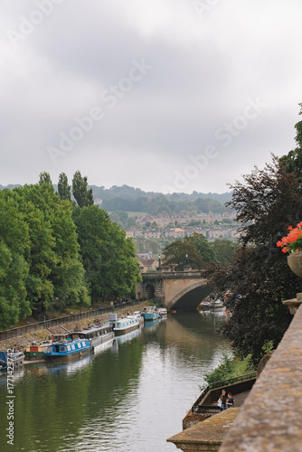 Canal boat and Kennet waiting for tourists on the River Avon, another fascinating travel experience in the city of Bath.