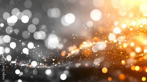 An abstract white bokeh lights effect background and a gradient gray background surround an empty, dark gray room.