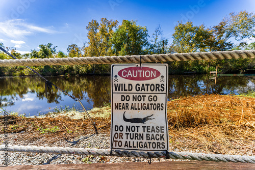 Alligator safety sign near swamp access, South Louisiana, USA
