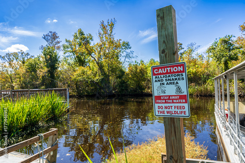 Alligator safety sign near swamp access, South Louisiana, USA