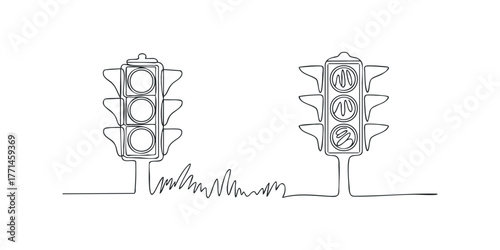 Traffic signals at intersection with grass