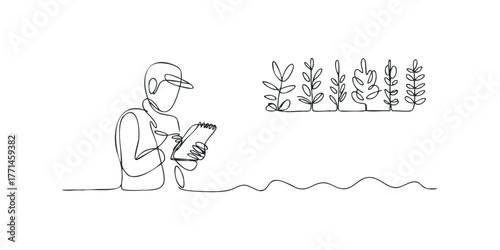 Scientist writing notes near seedling plants