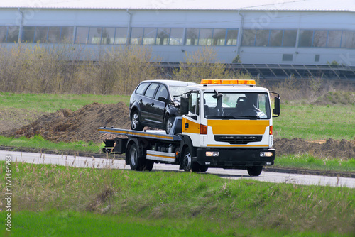 Wallpaper Mural Vehicle recovery tow truck hauling accident damaged car Torontodigital.ca
