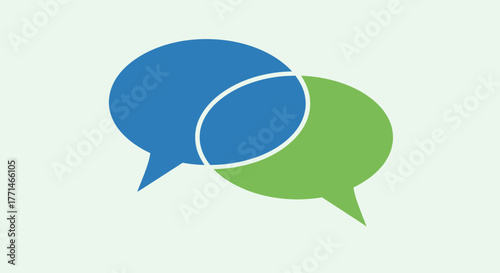 Two overlapping speech bubbles in blue and green, symbolizing communication, conversation, and dialogue, on a light gray background