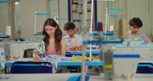 Indian young adult pupil gen z woman wear measure tape around neck sitting class room learn new casual course good sewing machine. focused teen female girl do self craft skill indoor day college place