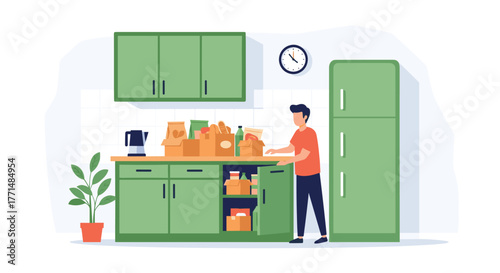 Man organizing grocery bags and boxes in a modern, clean kitchen with green cabinets and a refrigerator
