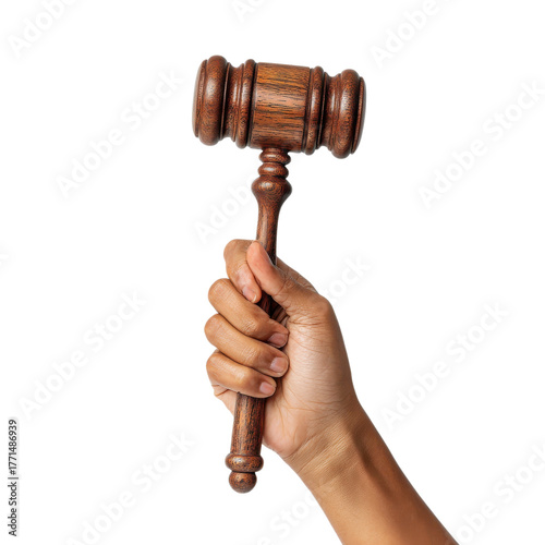 A hand grips a wooden gavel, representing justice and decision-making in a legal context