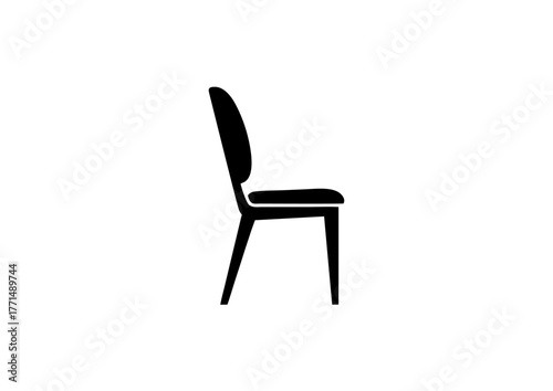 Seat of Simplicity: A Silhouette of Modern Chair—Curved Backrest, Flat Seat, and Tapered Legs Framed in the Quiet Geometry of Interior Elegance and Functional Minimalist Design