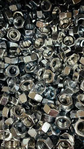 close up of a pile of metal screws
