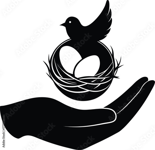 Hand holding bird's nest with eggs silhouette