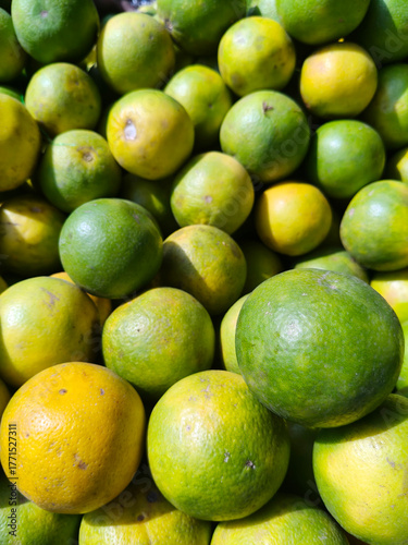 Close up shot of pile of fresh sweet lemon.