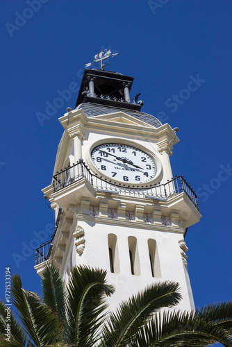 the facade of a clock tower in an ancient building in Valencia