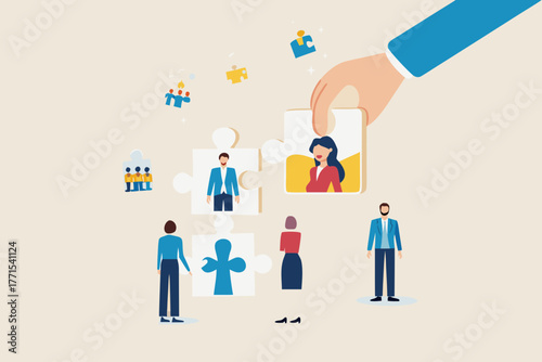 Hand placing a female employee puzzle piece into a team building concept with diverse people