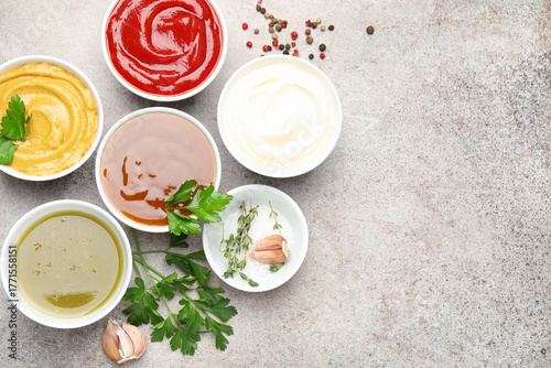 Wallpaper Mural Different sauces, spices and herbs on light table, flat lay. Space for text Torontodigital.ca