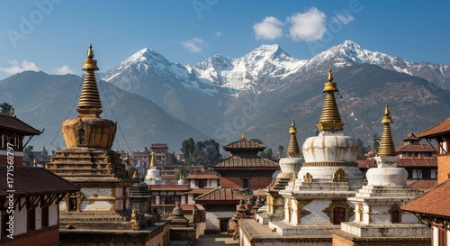 Temples and stupas in the kathmandu valley with snow capped mountains.