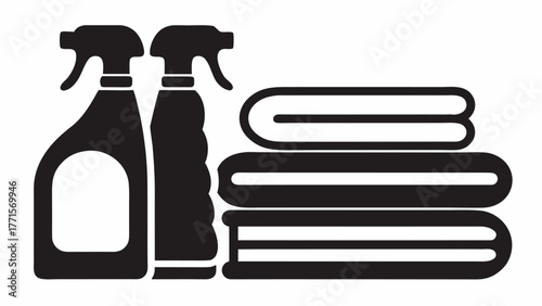 Cleanliness essentials featuring neatly folded towels and spray bottles, ideal for housekeeping services, laundry businesses, and promoting spotless environments