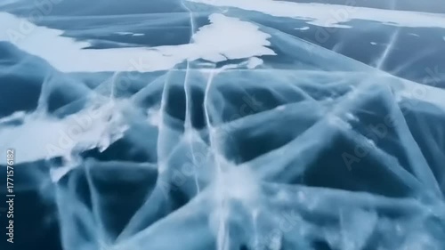 Aerial view of cracked ice formations on a lake