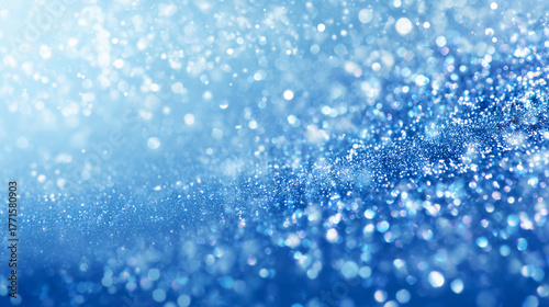 きらめく雪と光が舞う青いグラデーション背景