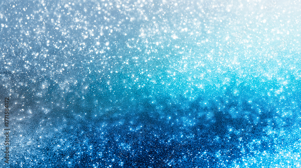 Obraz premium きらめく雪と光が舞う青いグラデーション背景