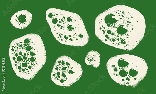 Green soap sponge bubble shapes set. Organic foamy stains with circular and irregular textures. Vector elements for eco detergent, skincare, or bathroom graphic design.