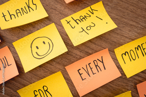 Positive and thankfull notes on a wooden background. Thanksgiving day