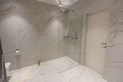 Amazing white marble master bathroom with large glass walk-in shower,