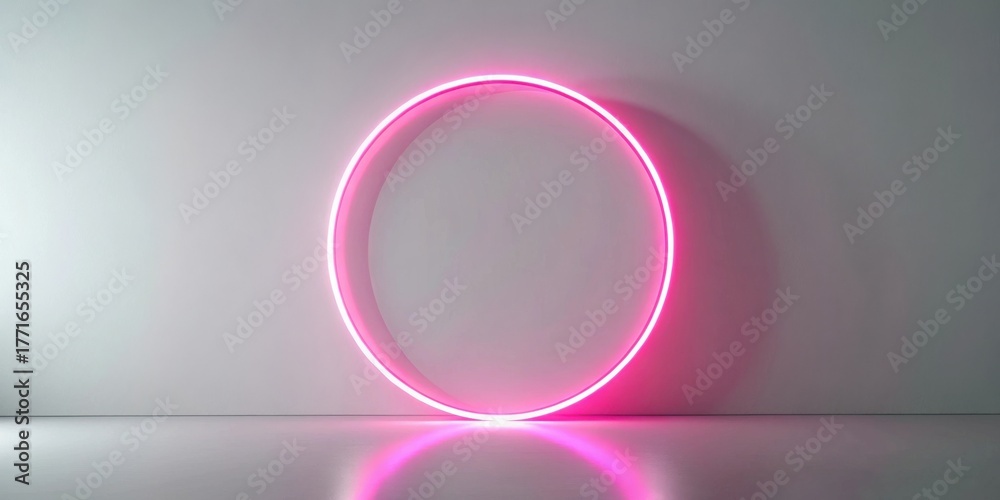 Obraz premium Pink neon ring on a white wall, minimalist design, bright light, modern interior, empty space