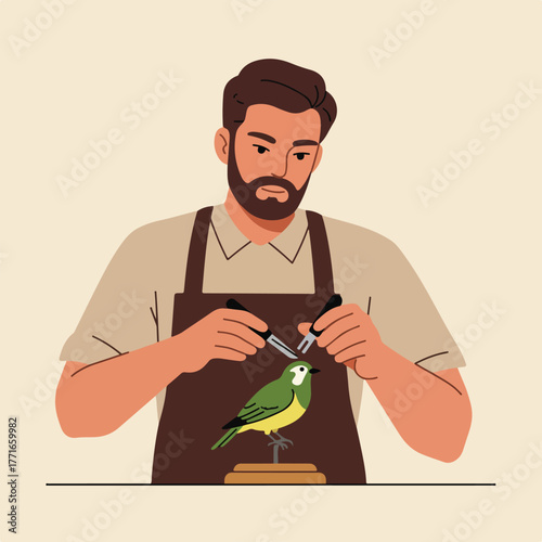 A bearded man in an apron carefully crafts a small bird statue with tools, focused on detail