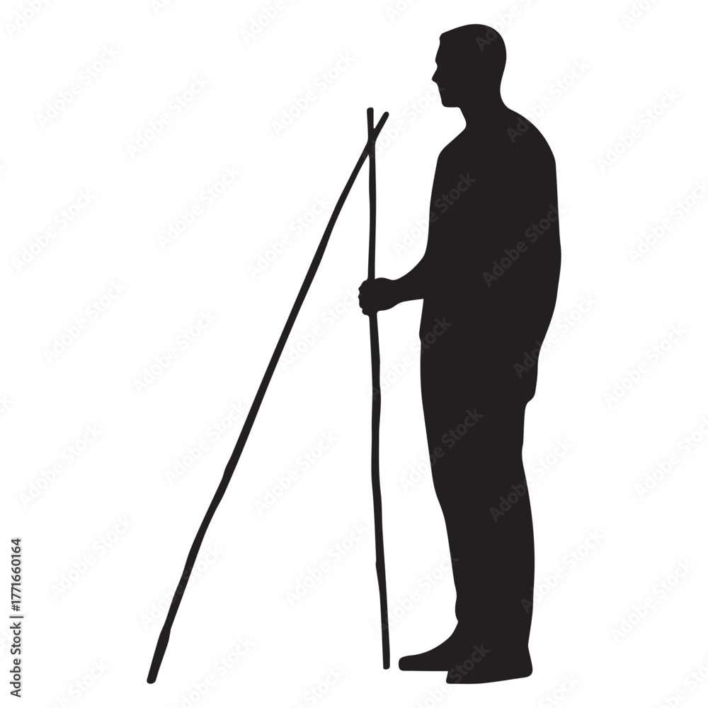 Obraz premium Silhouette of a man standing confidently holding a long straight stick horizontally. 