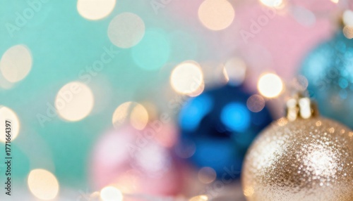 Abstract Christmas background with colorful bokeh lights. Festive glitter ornaments in gold, blue, and pink. Holiday celebration backdrop