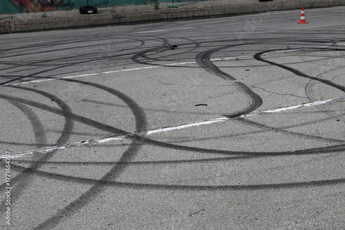 Traces of car wheels on the asphalt.