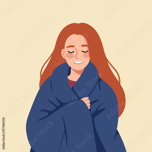 A red-haired person, eyes closed, smiles gently while wrapped in a blue garment, against a warm background