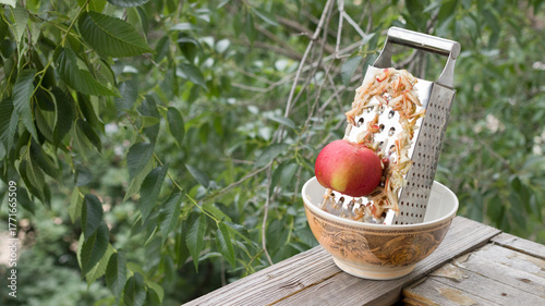 Grate the apple on a metal grater.