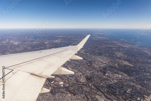 Great view looking out a plane window - Travel image over a city - New York USA