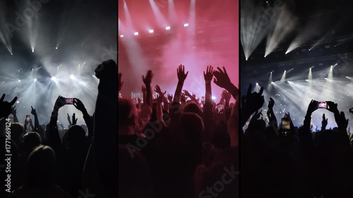 Clapping hands of people at a concert under spotlights.	