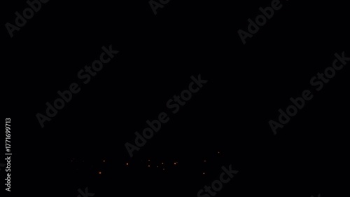 Dynamic Golden Sparks Erupting in the Darkness.