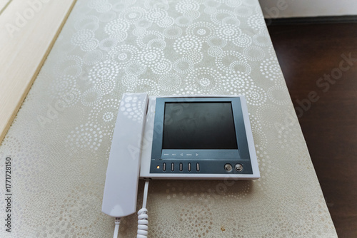 modern home intercom device, stylish video intercom featuring tactile controls and minimalist design