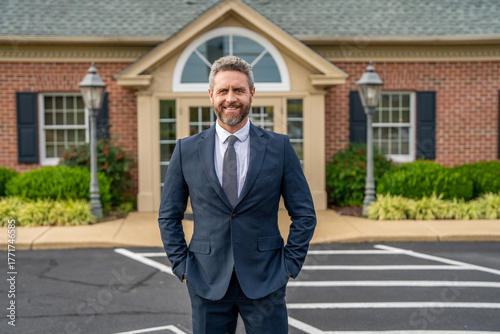 House for sale. Real estate purchase and sale. Insurance agent. Professional realtor offering house to buyer. Happy businessman broker. Insurance business. Real estate broker near new house