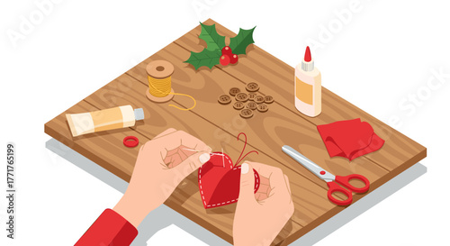 Crafting holiday decorations with red felt and holly on wooden table