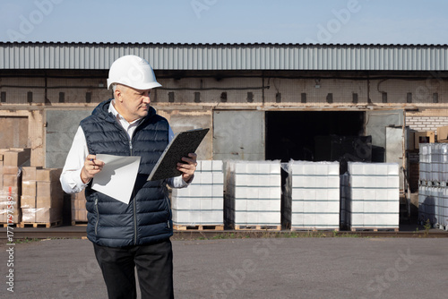 Warehouse supervisor inspec...