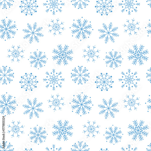 Seamless pattern of blue snowflakes on a white background. Minimal geometric winter design for Christmas and New Year cards, wrapping paper, fabric, wallpaper and holiday seasonal projects.