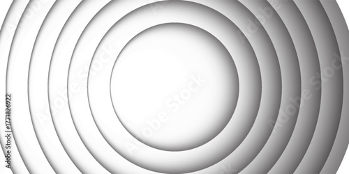 This image features a black and white concentric circle pattern with subtle gradations that create an effect of depth and dimension