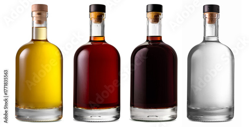 Set of a glass bottle with different color liquids. Isolated on a white background. Alcohol drinks: gin, vodka, brandy, rum, liqueur, whisky.