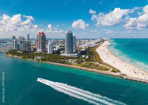 Aerial view of Miami marina skyline with yacht. Drone shot of Miami cityscape. Top view of South Miami and the ocean.