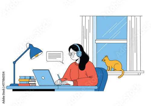 Young woman wearing headphones studying or working remotely on a laptop at her desk with a cat in the window.
