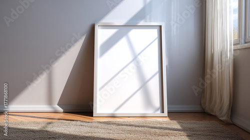 White frame leaning against wall with sunlight and carpet in a room setting
