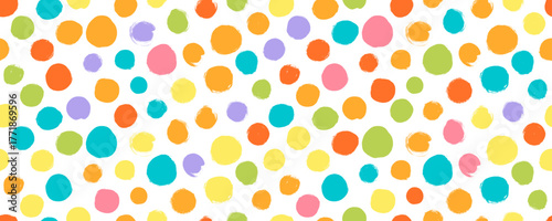 Colorful childish polka dot seamless pattern. Brush drawn bold circles and round shapes wrapping paper. Kid colorful confetti abstract bg. Baby vector circles seamless pattern.