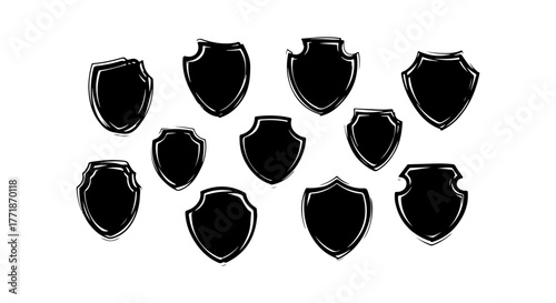 Collection of hand drawn shield emblems in black on white background